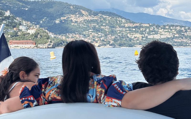 Guests on a private yacht charter looking out on the sea